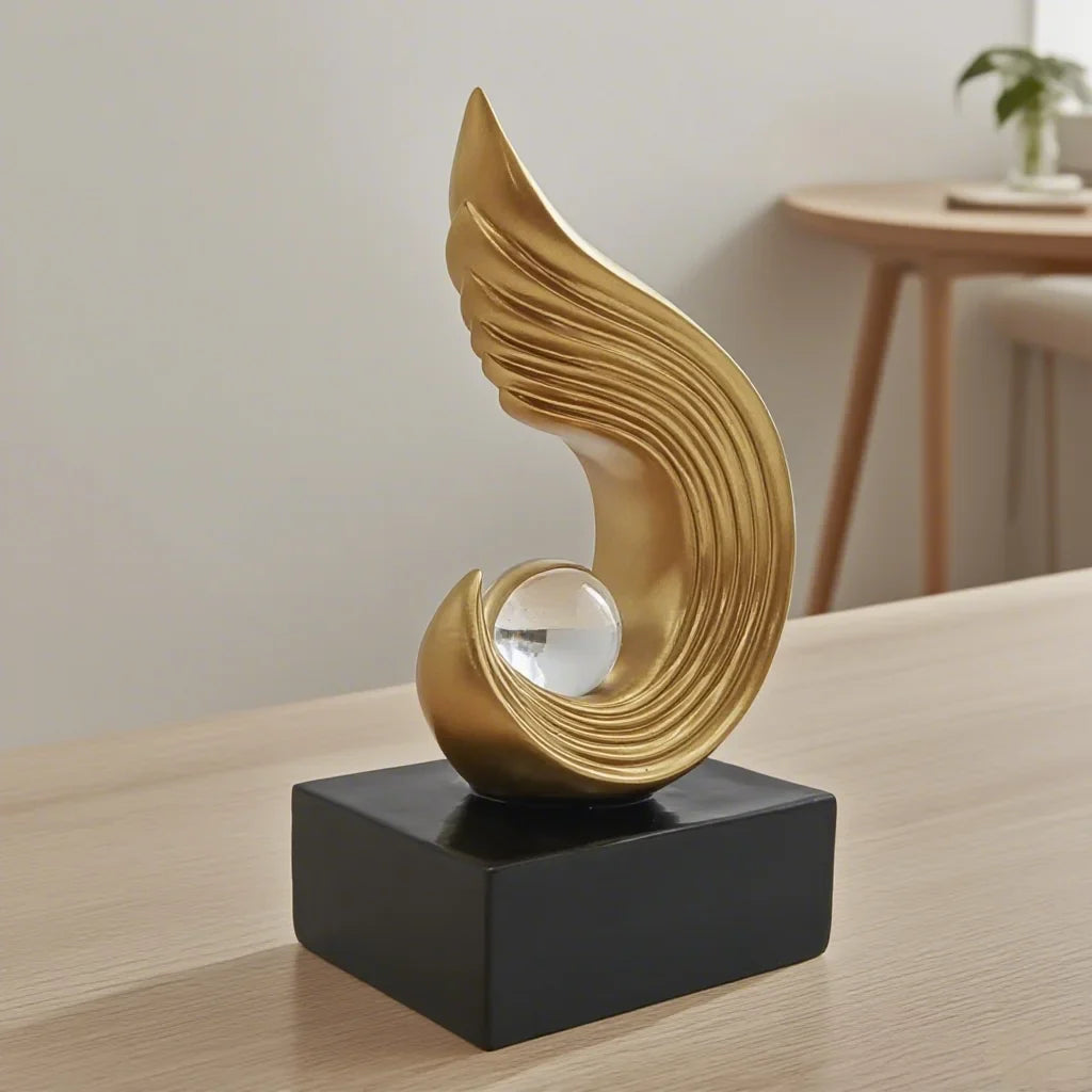 Modern Gold Flame Sculpture with White Sphere Decor Accent