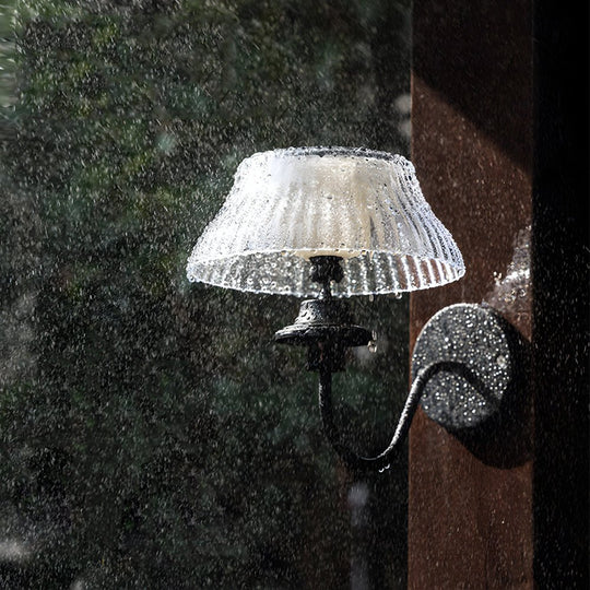Black Metallic Arm Solar Outdoor Wall Light with Adjustable Shade